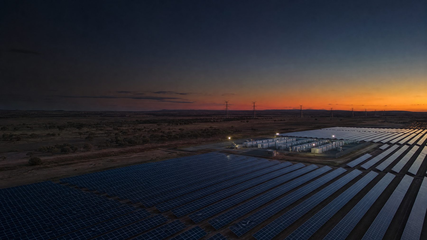 Aerial view of utility-scale solar, storage and transmission infrastructure
